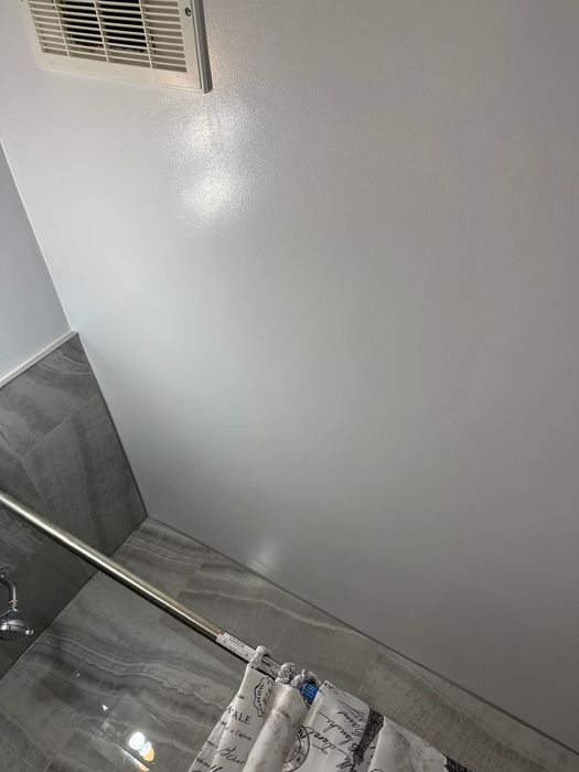 Fresh bathroom paint finished against new tile