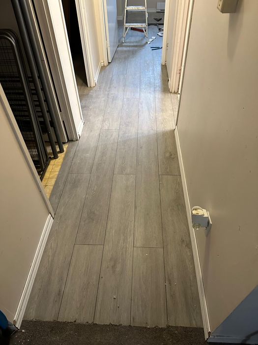 New plank flooring running through a hallway