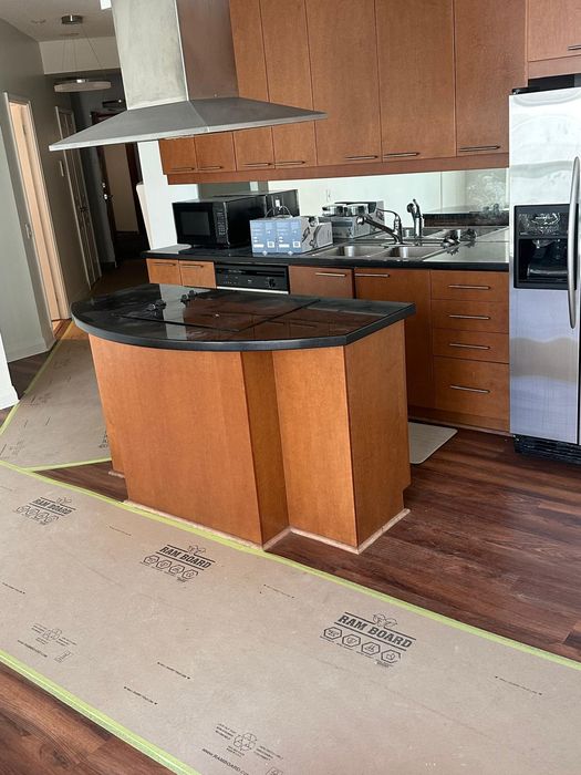 Kitchen renovation with floors protected before work begins